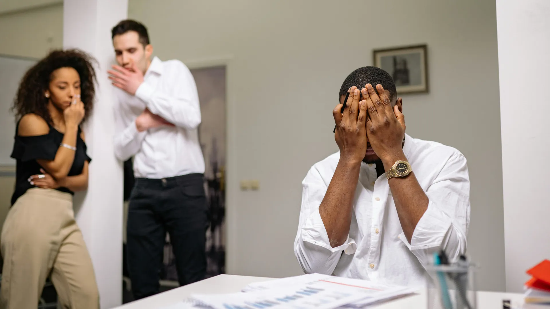 A man has had enough of the constant bickering that his business partners are throwing across. He is about to lose his temper.
