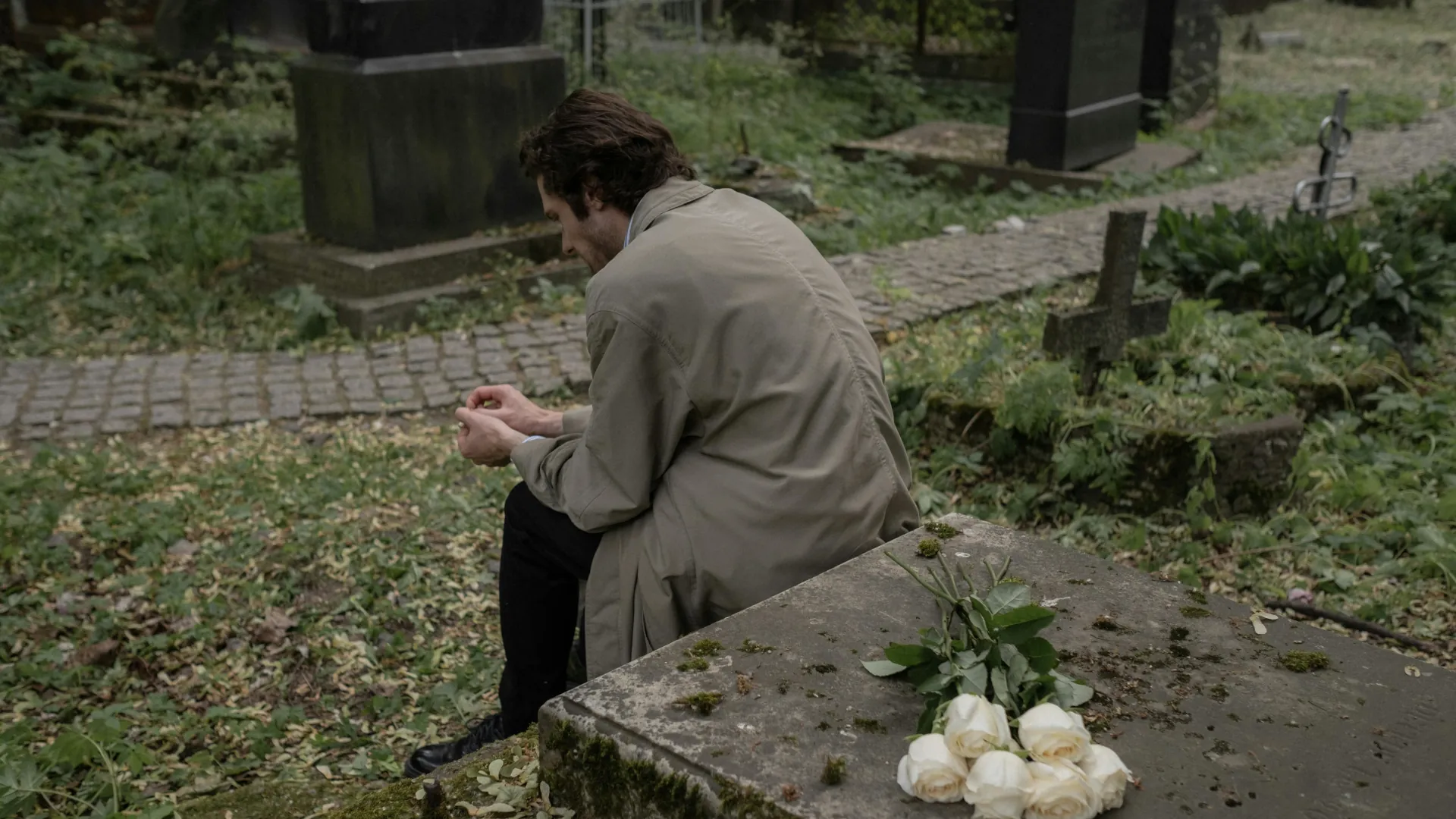 Young man trying to come to terms with the loss of a loved one.