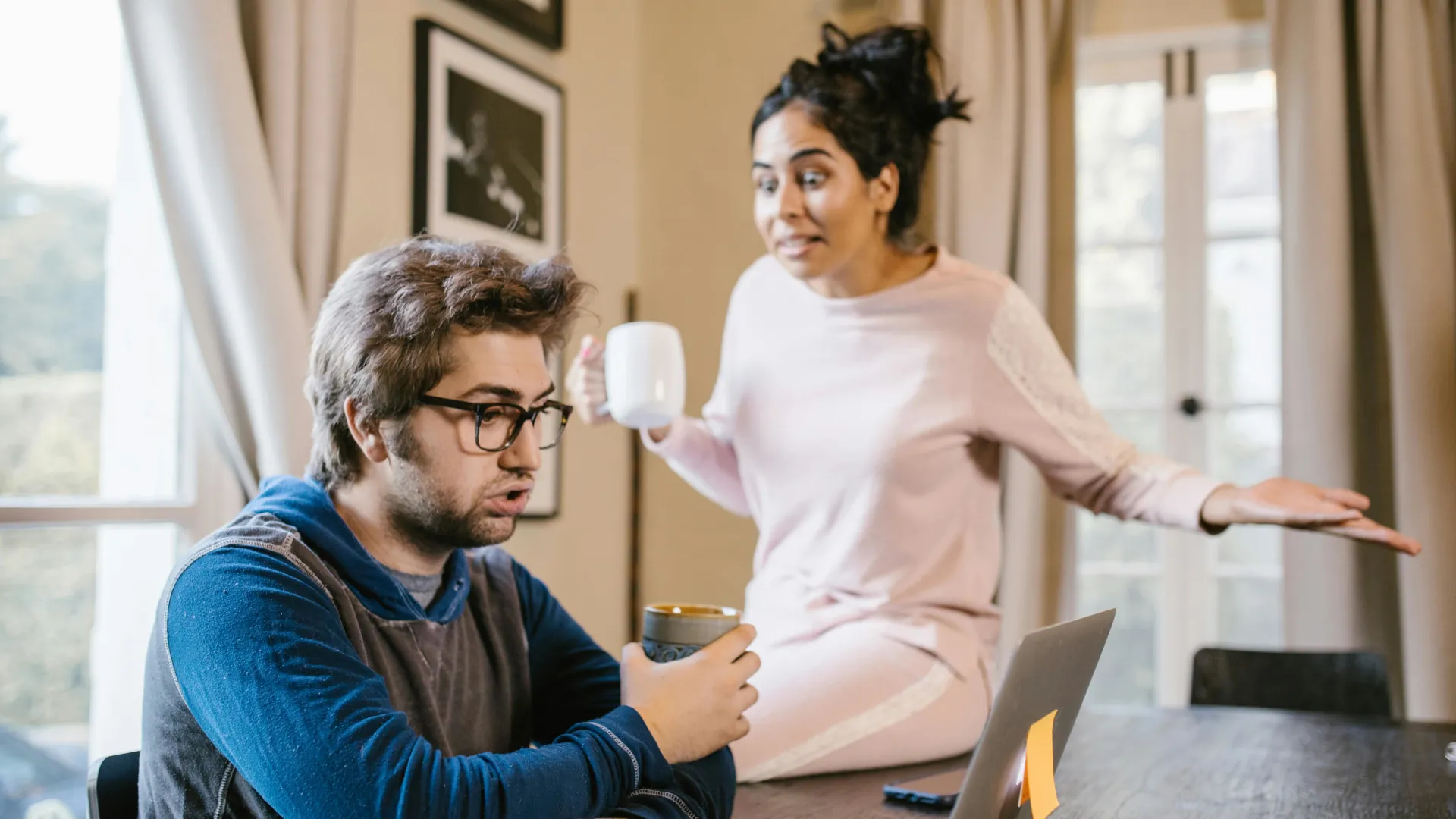 A young female is angry with her partner and is trying to talk to him about a situation. He is also getting distressed.