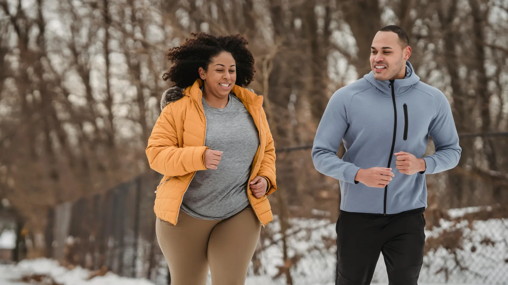 A young woman is running with her fitness therapist to try and control her weight issues.